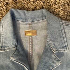 Beautiful jean jumpsuit only wore two times. Can dress up or down!